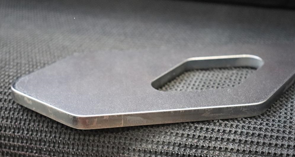 Precision edge rounded sheet metal component showing smooth burr-free edges prepared for powder coating.