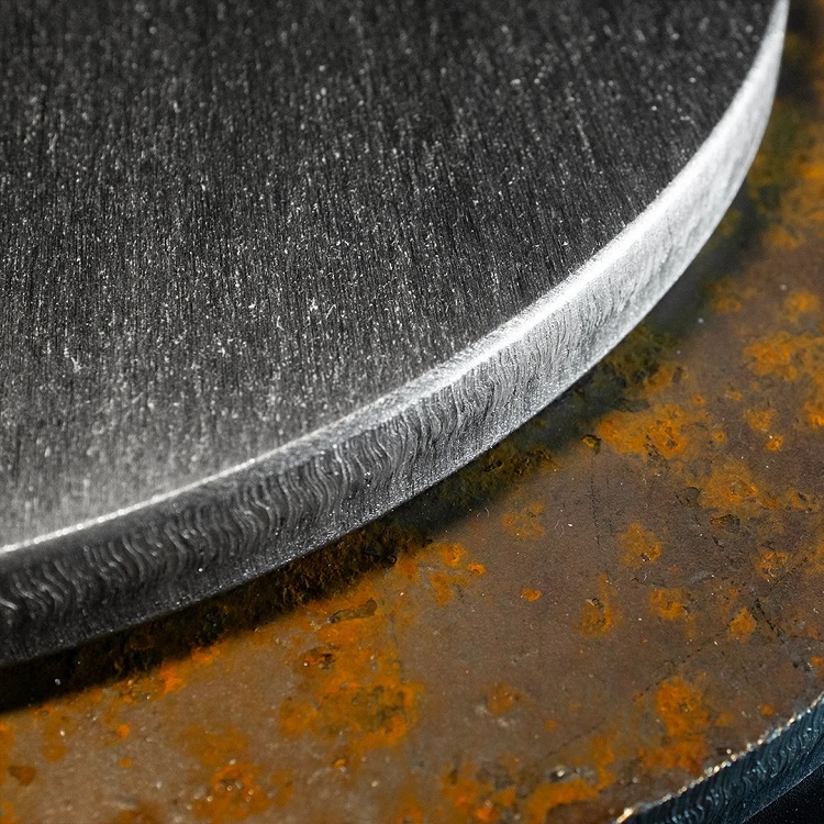 Laser cut sheet metal vertical edge with remaining oxide layer after surface sanding