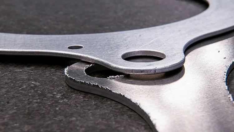 Stamped sheet metal edges before edge deburring and after deburring-sourced: shengenfab